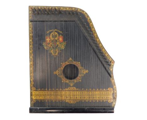 A Continental ebonised Zither, with printed detail, 40cm wide. 