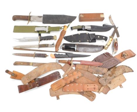 A quantity of hunting knives, leather scabbards, blade sharpener, World War I flechette etc. 