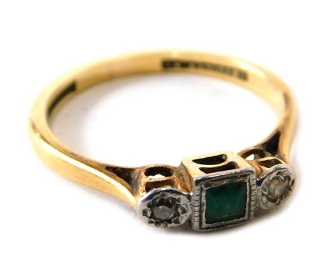 An emerald and diamond dress ring,  set with central square cut emerald in rub over setting, with tiny diamond to each side, 