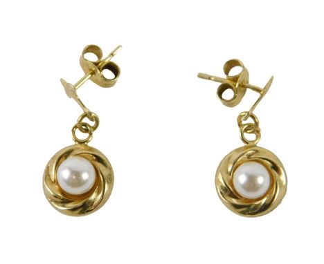 A pair of 9ct gold and Jersey pearl earrings, of drop design with single pin back and butterfly backs, 0.9g all in. 