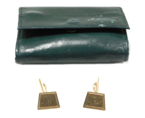 A pair of 9ct gold cufflinks, each with engine engraved border, bearing the initials K, 8.9g, in green jewellery sleeve. 