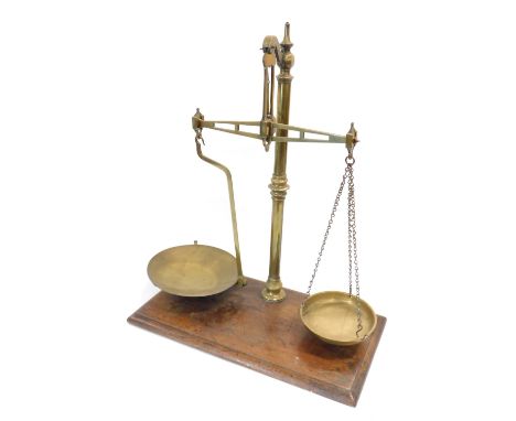 A set of brass and mahogany scales, with turned beam, 50cm wide. 