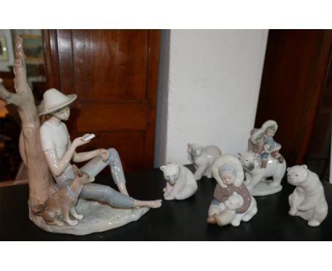 A collection of Lladro figurines to include Eskimo Riders, Polar bears, an Eskimo with a polar bear, and a Nao Boy reading wi