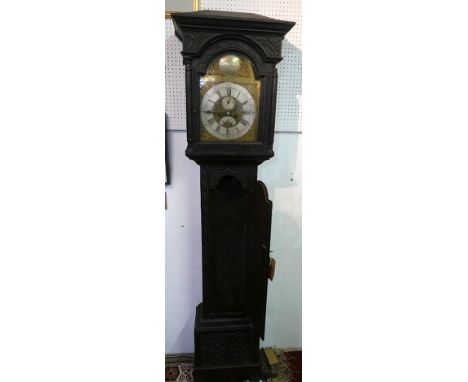 A George III stained oak 8 day longcase clock, arched silvered brass dial with Roman and Arabic numerals, mat centre with sec