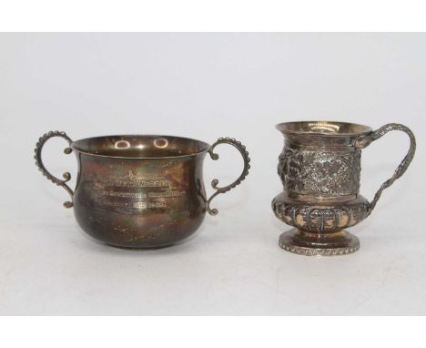 A George IV silver christening cup, having entwined serpent handle, relief decorated with vines and lion mask, London 1821, 4
