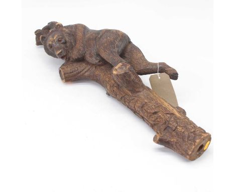 An early 20th century Black Forest carving of a bear climbing a tree stump, 73cm (probably part of a larger hall/stick stand)