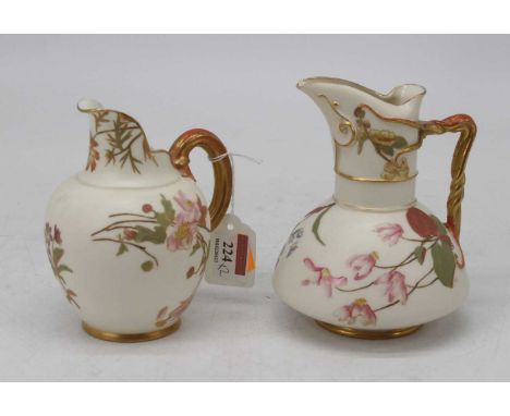 A Royal Worcester old ivory cleft jug, shape 1094, puce mark, height 14cm, together with another Royal Worcester old ivory ju