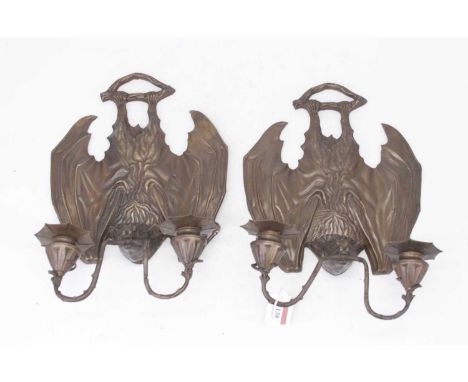 A pair of modern pressed metal twin sconce wall light fittings each in the form of a bat, height 34cm