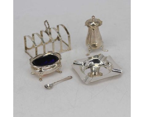 A George V silver four-division toast rack of arched form, surmounted by a handle; together with a silver open salt, of shape