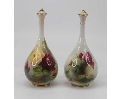 A pair of Royal Worcester vases, decorated with roses and signed Hood, shape F105, height 23cmBoth lids are missing the finia