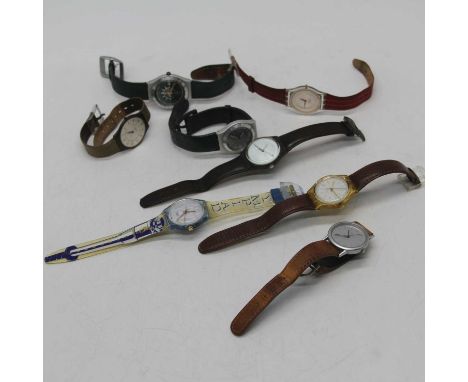 A collection of Swatch wristwatches, to include translucent perspex cased examples; together with a further gent's wristwatch