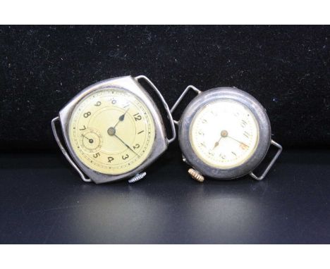 An Art Deco gents silver cased tank watch having manual wind movement, together with a ladies silver cased manual wind wrist 