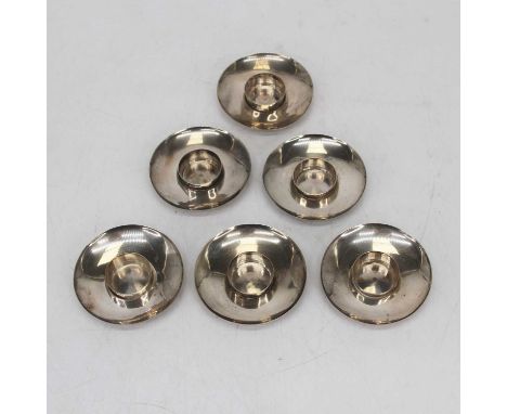 A set of six Edward VII silver candlesticks, each of squat circular form, Birmingham 1908, 3ozt