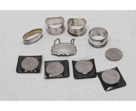 A silver decanter label inscribed Sherry (marks rubbed); together with four silver napkin rings; and five commemorative crown