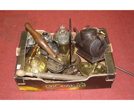 A box of miscellaneous items to include a brass chamber stick, a hand pump, brass kettle etc