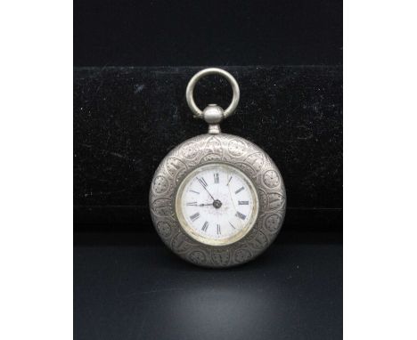 An American fine silver cased keyless pocket watch, having unsigned white enamel Roman dial, and engraved case, dia. 4cm