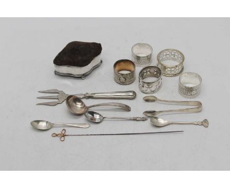 An Edwardian silver pin cushion, of shaped outline upon scroll feet; together with five plated napkin rings; and silver plate