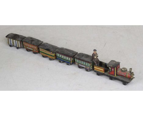 A Japanese tinplate toy steam engine with carriages, engine 9cm 