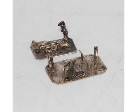 A contemporary silver place-card holder in the form of a farmyard figure group, together with another (a/f), gross weight 1.5