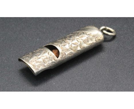 A silver and engraved pendant whistle, early 20th century, marks worn, 4.5cm