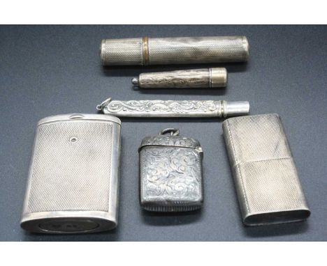 Assorted silver wares to include vesta, engine turned cylindrical lighter, cheroot holder, pencil sleeve etc (6)
