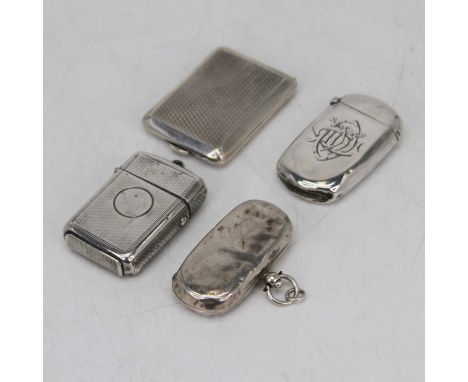 A Victorian silver vesta case, having engraved decoration, London 1869; together with two other silver vesta cases; and a sil