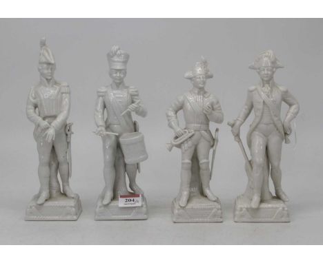 A set of four Dresden blanc-de-chine porcelain military figures, the tallest h.25cm 