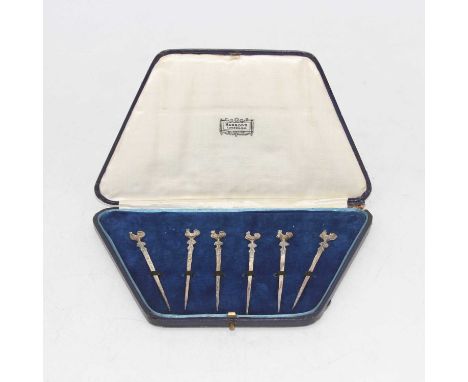 A cased set of six silver cocktail sticks, each surmounted by a cockerel, retailed by Harrod's of London, London 1927 