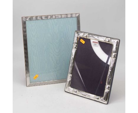 A contemporary continental silver clad easel photo frame of rectangular form 33x28cm, together with one other smaller example