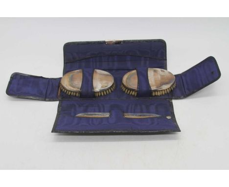 A George V silver brush set, in blue leather case, Birmingham 1911