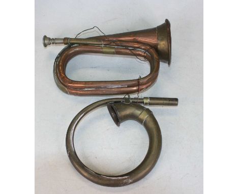 A vintage copper and brass bugle, together with one other 