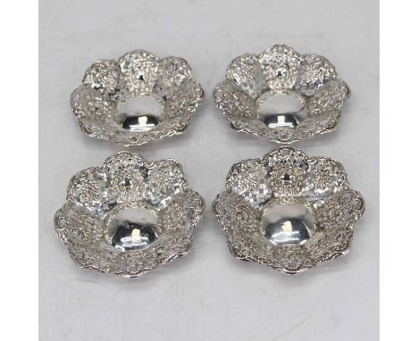 A set of four Victorian pierced silver dishes, with foliate decoration, Chester 1899, each w.10cm, gross weight 2.3ozt