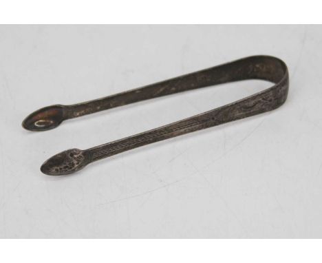 A pair of George III silver sugar nips, with bright-cut decoration, London 1798, 1ozt