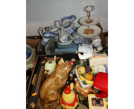 Two boxes of miscellaneous items, to include a large pottery model of a seated cat, novelty teapots, blue and white dinnerwar