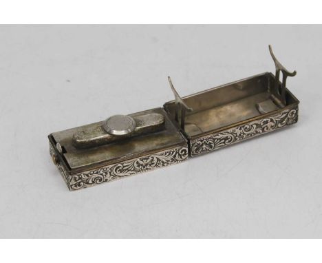 An Edwardian silver cased travelling curling tong burner, repousse decorated with foliage and cherubs, London 1901Looks to be