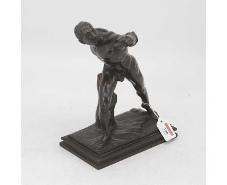 A bronzed model of a warrior, the nude male figure in mid pose, after the antique "The Borgheses Gladiator", h.28cm.The figur