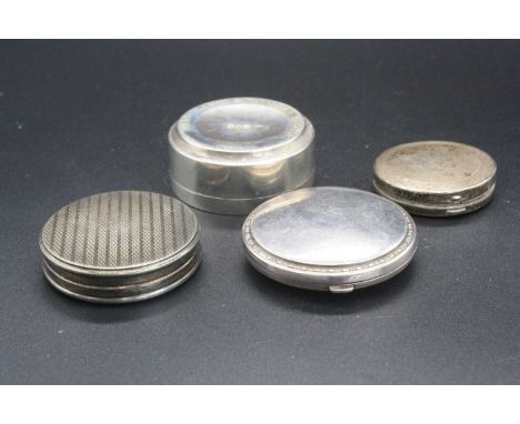 An engine turned silver snuff or pill box together with three others, one having presentation inscription, gross weight 5.1oz