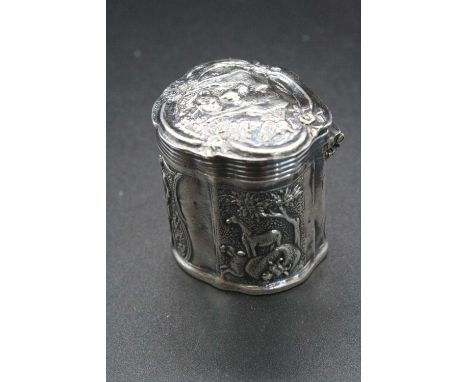 A late 19th century continental silver snuff box embossed with hunting scenes, having hinge cover and late Victorian London a