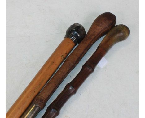 A Victorian silver handled walking stick, having a mallacca shaft, 88cm; together with two further walking sticks 