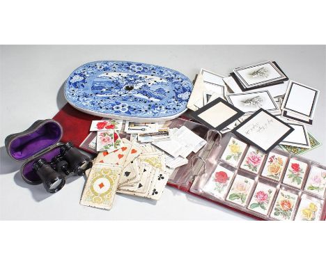 Mixed works of art, to include a pair of opera glasses, a strainer, a Battersea enamel, cigarette cards, playing cards, etc (