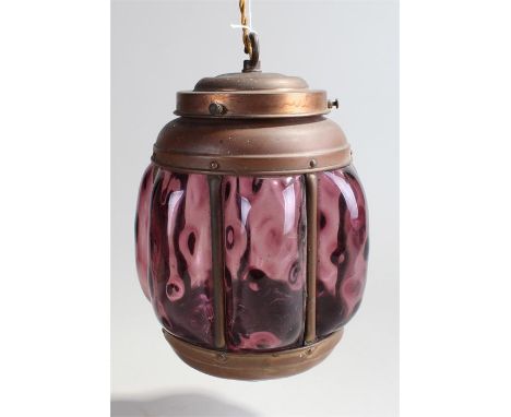 Arts and crafts hanging lamp, in copper frame and dimpled mauve glass