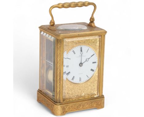 A 19th century French gilt brass carriage clock, by Grohe, 7 Wigmore Street, London, circular white enamel dial with black Ro