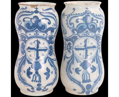 A pair of Italian 18th century faience pottery Albarello drug jars, decorated with coats of arms, height 27cm1 jar has a rim 