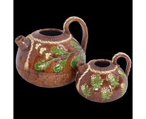 A pair of graduated Rye Pottery Bellevue jugs, largest height excluding handle 9cmLargest jug handle has been broken and rest