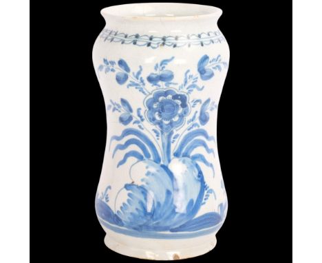 An 18th century Italian Maiolica Albarello drugs jar, decorated with flowers, height 18cmMinor chip on the foot rim, glaze ch