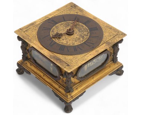 A German gilt-brass horizontal table clock, signed C Wolf of Paris, Augsburg, 17th century, 4.5" dial with Roman numeral hour