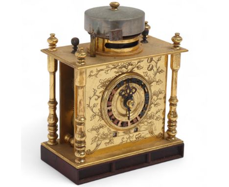 A Japanese Meiji Period hardwood and gilt-brass Makura Dokei 'Pillow Table Clock', surmounted by a bell over 4 free-standing 
