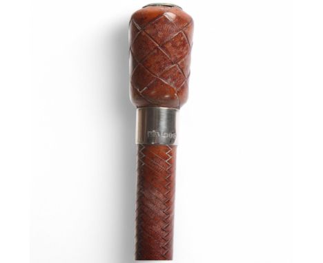 A Swaine & Adeney woven leather riding whip with silver ferrule, hallmarks 1965, length 71cm Good condition