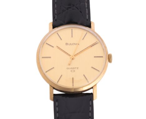 BULOVA - a 9ct gold quartz wristwatch, circa 1970s, champagne dial with gilt baton hour markers, pencil hands and sweep centr