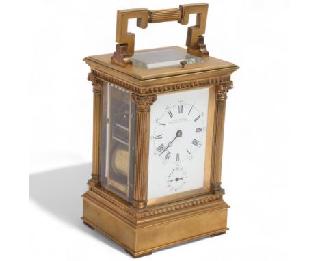 A 19th century French brass repeater alarm carriage clock, retailed by Reid & Sons of Newcastle On Tyne, white enamel dial wi